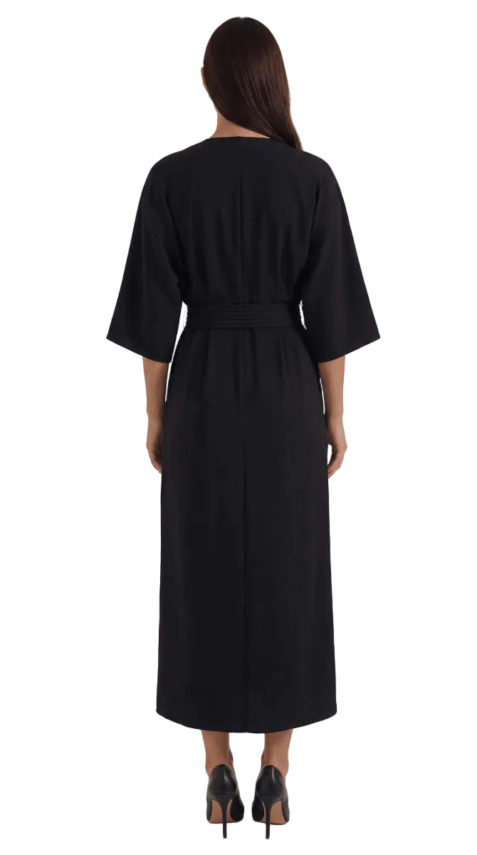 Black dress worn by a person on a white background