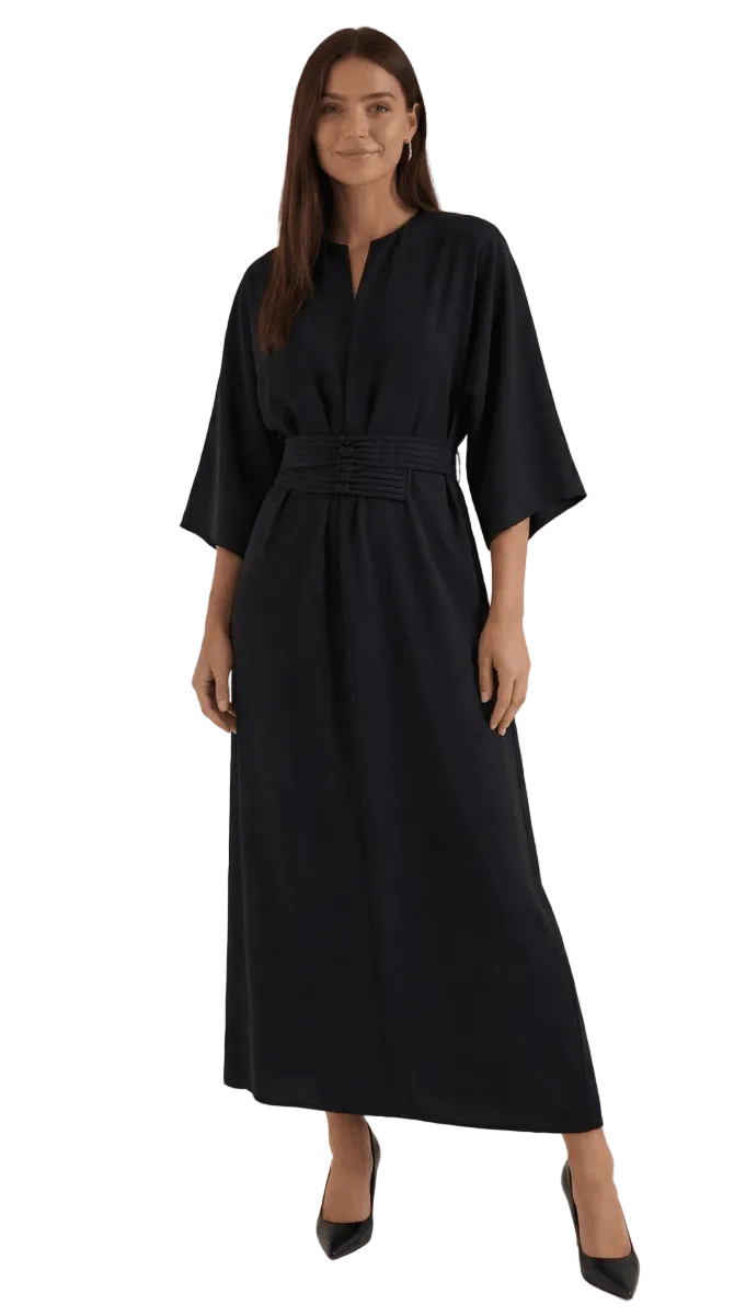 Woman wearing a black dress on a white background