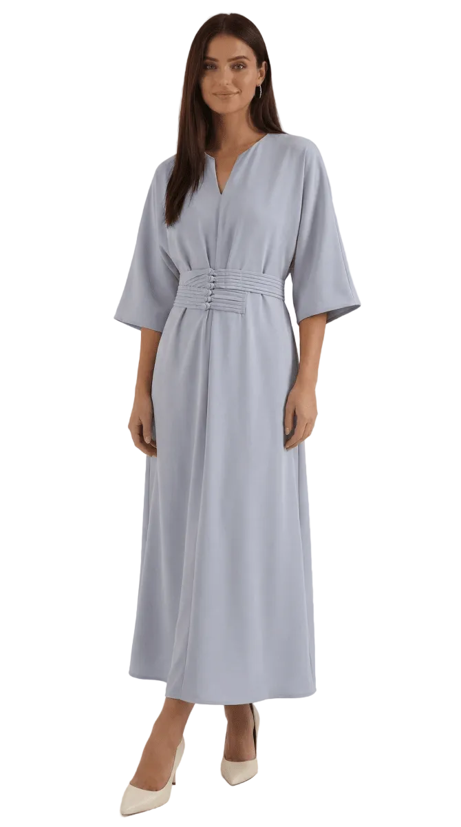 Woman wearing a light blue dress with a belt on a white background