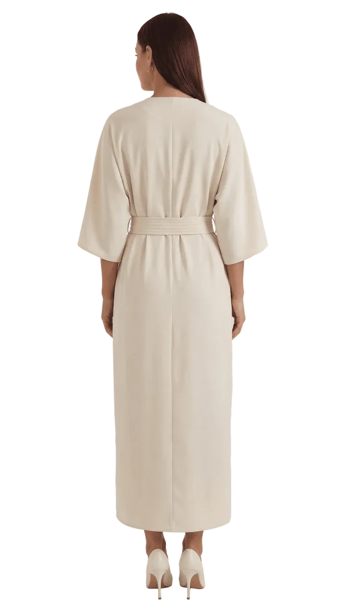 Woman wearing a beige robe on a white background