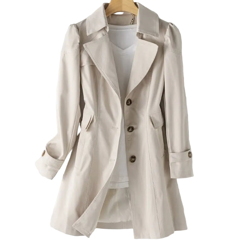 Beige trench coat on a hanger with a white background