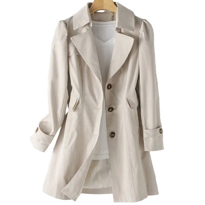 Beige trench coat on a hanger with a white background