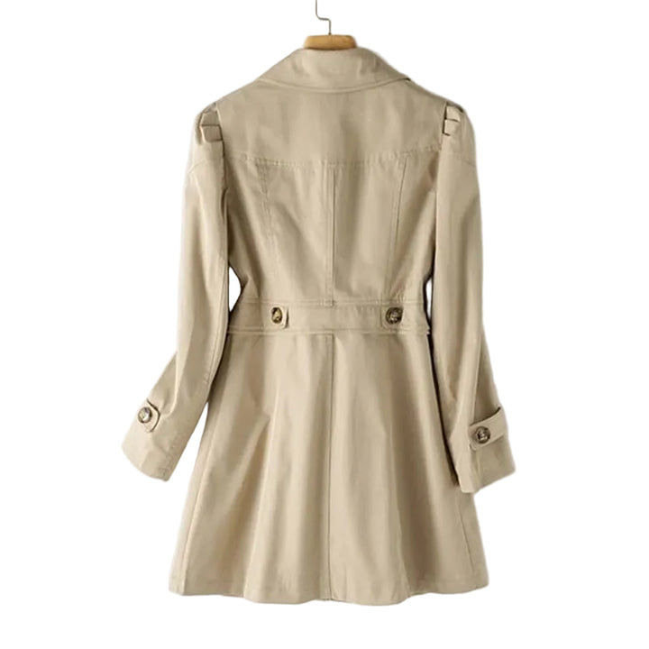 Beige trench coat on a hanger against a white background