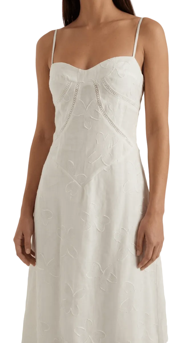 White lace dress on a plain background