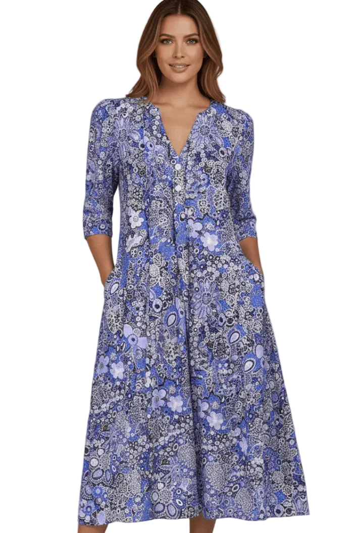 Woman wearing a blue floral dress on a white background
