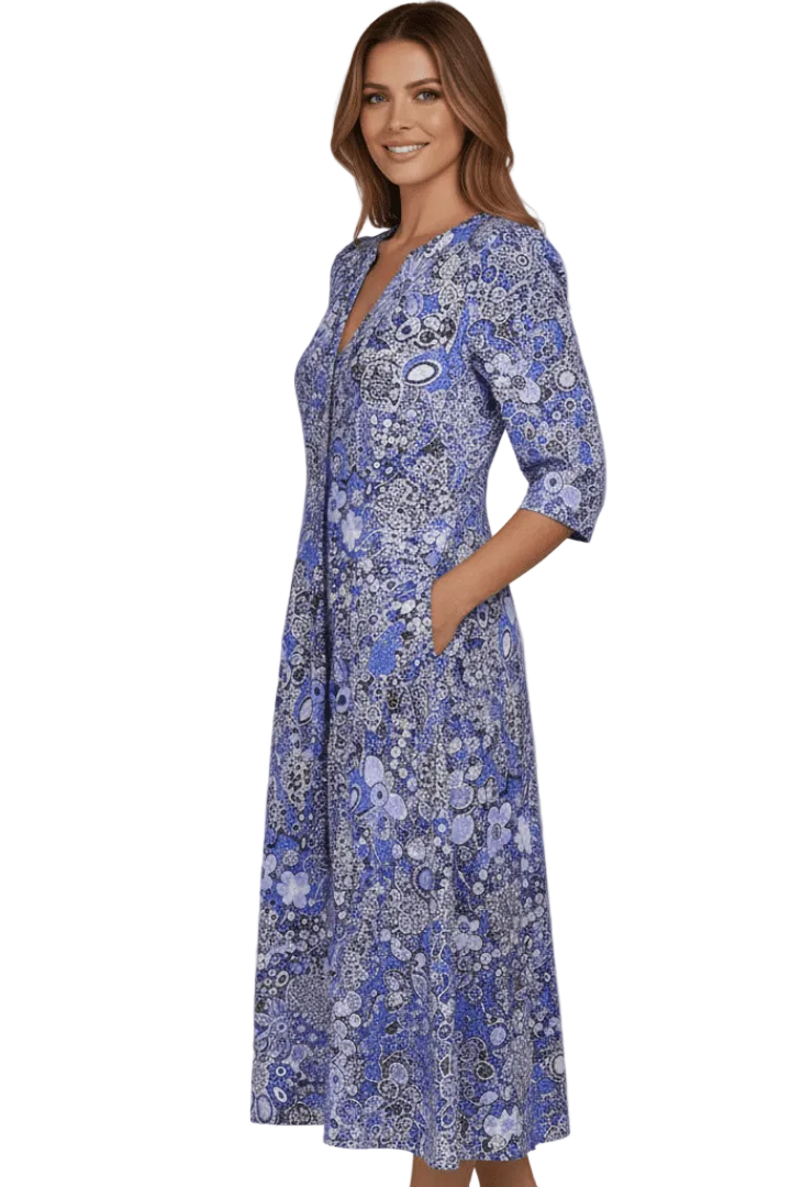 Woman wearing a blue floral dress on a white background