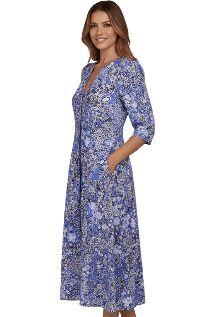 Woman wearing a blue floral dress on a white background