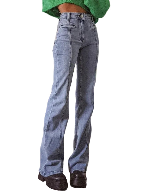 Person wearing blue jeans and a green sweater white background.