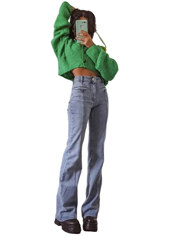 Person wearing a green sweater and blue jeans on a white background