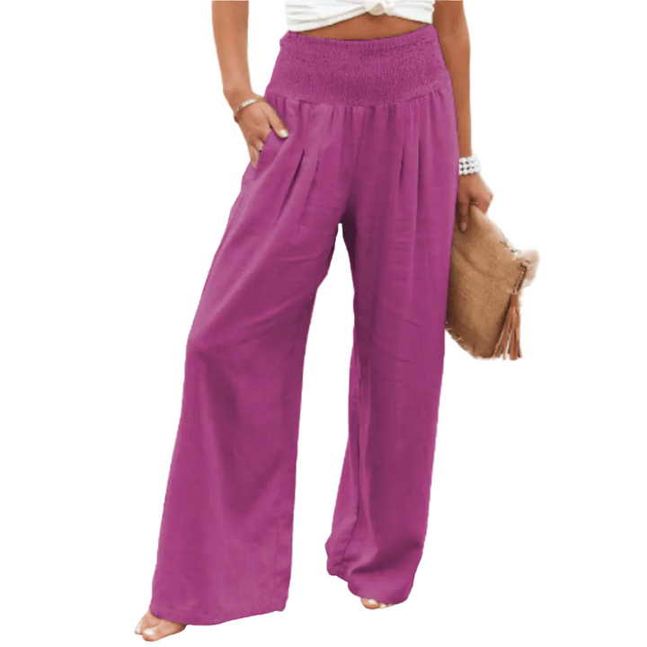 Purple wide-leg pants worn by a person on a white background.